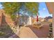 Landscaped backyard with shed, picnic table, and garden at 2134 Dillons Cove Dr, Laughlin, NV 89029