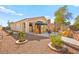 Backyard with covered patio, gravel landscaping, and seating area at 2134 Dillons Cove Dr, Laughlin, NV 89029