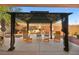 Relaxing backyard patio with gazebo, seating, and umbrella at 2134 Dillons Cove Dr, Laughlin, NV 89029