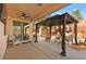 Covered patio with comfortable seating and access to backyard at 2134 Dillons Cove Dr, Laughlin, NV 89029