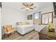 Comfortable guest bedroom with a queen-size bed and an armchair at 2134 Dillons Cove Dr, Laughlin, NV 89029