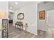 Bright entryway with console table, mirror, and view to living room at 2134 Dillons Cove Dr, Laughlin, NV 89029