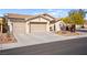 Two-car garage and well-maintained landscaping at 2134 Dillons Cove Dr, Laughlin, NV 89029