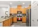 Modern kitchen with wood cabinets, granite countertops and stainless steel appliances at 2134 Dillons Cove Dr, Laughlin, NV 89029