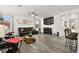 Spacious living room with hardwood floors, fireplace, and large TV at 2134 Dillons Cove Dr, Laughlin, NV 89029