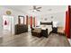 Large main bedroom with king-size bed, dresser, and ensuite bathroom access at 2134 Dillons Cove Dr, Laughlin, NV 89029