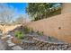 Landscaped backyard with terraced garden beds, stone pathways, and a serene, private setting at 29 Desert Highlands Dr, Henderson, NV 89052