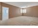 Neutral bedroom featuring carpet floors and plantation shutters at 29 Desert Highlands Dr, Henderson, NV 89052