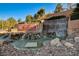 The Anthem by Del Webb entrance features stone waterfalls, desert landscaping, and elegant community signage at 29 Desert Highlands Dr, Henderson, NV 89052
