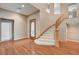 Grand entryway features a winding staircase and a decorative glass front door, creating an inviting atmosphere at 29 Desert Highlands Dr, Henderson, NV 89052
