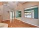 Bright living room with hardwood floors, a view of the pool, and a seamless connection to the outdoor space at 29 Desert Highlands Dr, Henderson, NV 89052