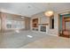Cozy living room featuring a fireplace, built-in shelving, and ample natural light at 29 Desert Highlands Dr, Henderson, NV 89052
