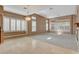 Bright living room with a mix of carpet and tile flooring and plantation shutters at 29 Desert Highlands Dr, Henderson, NV 89052