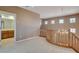Carpeted loft with high ceilings and chandelier at 29 Desert Highlands Dr, Henderson, NV 89052
