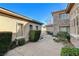 Landscaped courtyard with stone pathway and manicured hedges at 29 Desert Highlands Dr, Henderson, NV 89052