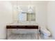Elegant bathroom with double vanity, marble floors and chandelier at 4471 Dean Martin Dr # 507, Las Vegas, NV 89103