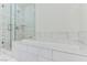 Bathroom with soaking tub and marble tile at 4471 Dean Martin Dr # 507, Las Vegas, NV 89103