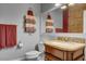 Bathroom with granite vanity, toilet, and decorative towel rack at 5100 Jordan Frey St # 203, Las Vegas, NV 89130