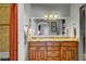 Bathroom features double vanity, granite countertops, and large mirror at 5100 Jordan Frey St # 203, Las Vegas, NV 89130