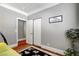 Bedroom with gray walls, wood floors, and a double door closet at 5100 Jordan Frey St # 203, Las Vegas, NV 89130