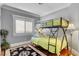 Bedroom with bunk beds, light green bedding, and wood floors at 5100 Jordan Frey St # 203, Las Vegas, NV 89130