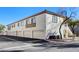 Exterior view of building with multiple garages at 5100 Jordan Frey St # 203, Las Vegas, NV 89130