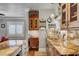 Kitchen features granite countertops, stainless steel appliances, and custom wood cabinetry at 5100 Jordan Frey St # 203, Las Vegas, NV 89130