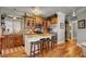 Island kitchen with granite countertops and wood cabinets at 5100 Jordan Frey St # 203, Las Vegas, NV 89130