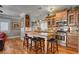 Open kitchen with granite countertops and custom cabinetry at 5100 Jordan Frey St # 203, Las Vegas, NV 89130