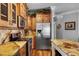Kitchen boasts granite countertops, stainless steel appliances, and custom wood cabinets at 5100 Jordan Frey St # 203, Las Vegas, NV 89130