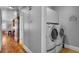 Laundry room with washer, dryer, and overhead storage at 5100 Jordan Frey St # 203, Las Vegas, NV 89130