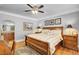 Main bedroom features hardwood floors, ensuite bathroom access, and ceiling fan at 5100 Jordan Frey St # 203, Las Vegas, NV 89130