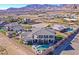 Desert home featuring an outdoor living space, fire pit, and pool at 5790 Aspen Falls Cir, Las Vegas, NV 89149