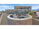 Luxury home showcasing outdoor fire pit and stunning desert landscape at 5790 Aspen Falls Cir, Las Vegas, NV 89149