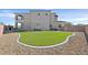 Low maintenance backyard featuring artificial turf and desert landscaping at 5790 Aspen Falls Cir, Las Vegas, NV 89149