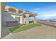 Outdoor kitchen with mountain views, integrated into manicured backyard at 5790 Aspen Falls Cir, Las Vegas, NV 89149