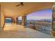 Large balcony with stone columns overlooking the Las Vegas skyline provides a stunning and peaceful retreat at 5790 Aspen Falls Cir, Las Vegas, NV 89149