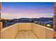 Balcony view of the city lights and mountain range in the background at 5790 Aspen Falls Cir, Las Vegas, NV 89149