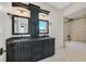 Modern bathroom featuring dual sinks, a granite countertop, and a tiled shower and tub at 5790 Aspen Falls Cir, Las Vegas, NV 89149