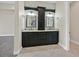 Bathroom with double vanity, granite countertop, and custom mirrors at 5790 Aspen Falls Cir, Las Vegas, NV 89149