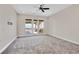 Bedroom with doors that lead to a patio with mountain views at 5790 Aspen Falls Cir, Las Vegas, NV 89149
