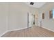Spacious bedroom with wood floors, neutral walls, and an open doorway at 5790 Aspen Falls Cir, Las Vegas, NV 89149