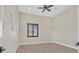 Bright bedroom featuring light-colored wood floors, plantation shutters, and ample natural light at 5790 Aspen Falls Cir, Las Vegas, NV 89149