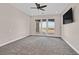 Expansive bedroom with gray carpet and access to a private balcony with a view at 5790 Aspen Falls Cir, Las Vegas, NV 89149