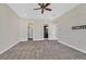 Spacious bedroom with a ceiling fan, and entryways to the bathroom and closet at 5790 Aspen Falls Cir, Las Vegas, NV 89149