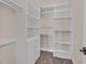 Walk-in closet featuring custom shelving for optimal storage and organization at 5790 Aspen Falls Cir, Las Vegas, NV 89149