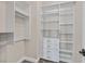 Walk-in closet featuring custom shelving for optimal storage and organization at 5790 Aspen Falls Cir, Las Vegas, NV 89149