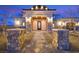 Elegant front entrance with stone pillars and pathway leading to a beautifully designed door at 5790 Aspen Falls Cir, Las Vegas, NV 89149