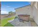 Backyard with artificial turf featuring a luxurious hot tub and desert view at 5790 Aspen Falls Cir, Las Vegas, NV 89149