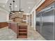 Gourmet kitchen with a stone backsplash, stainless steel appliances, and a granite-topped island at 5790 Aspen Falls Cir, Las Vegas, NV 89149